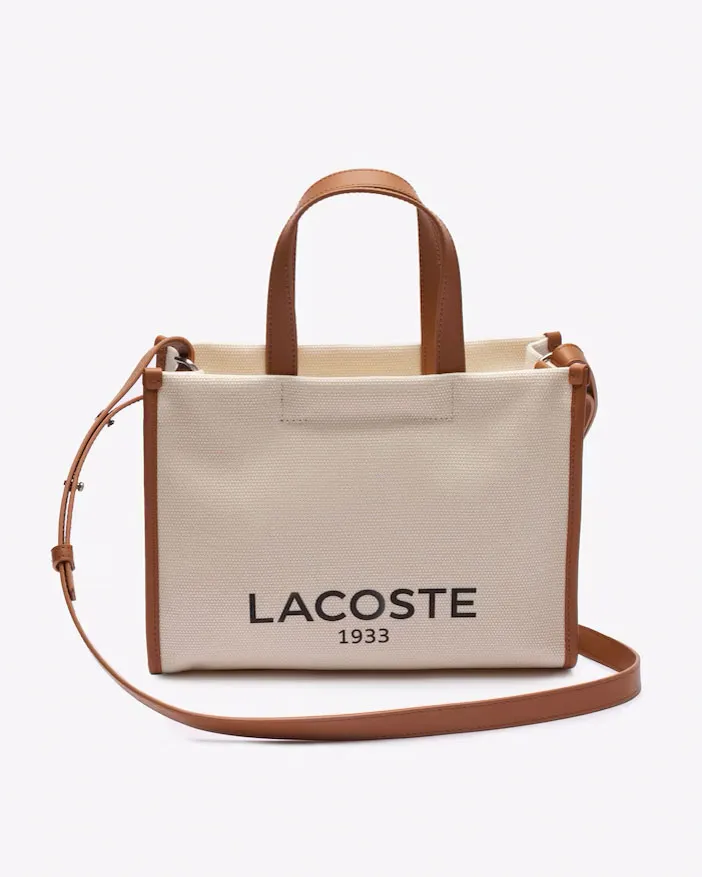 Borsa piccola a mano in canvass di cotone color naturale con scritta logo e profili in similpelle color cuoio