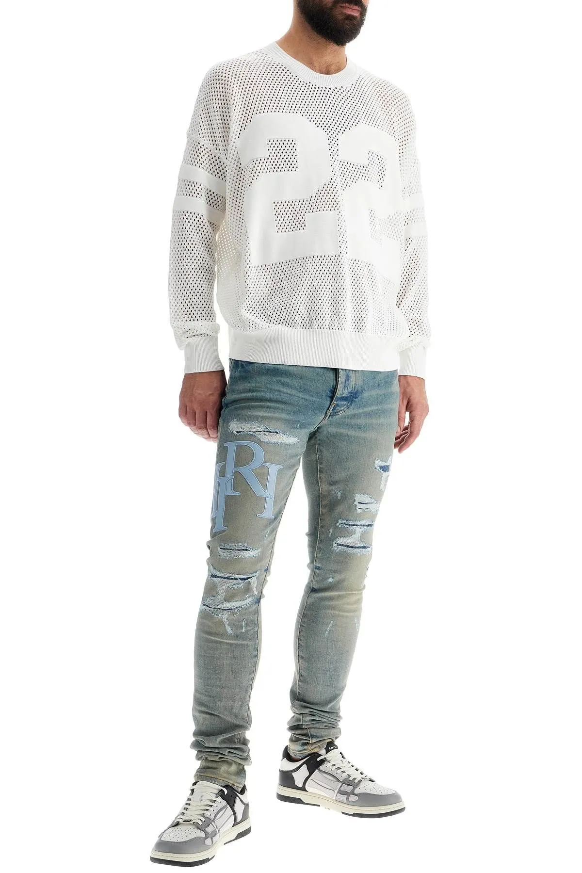 Jeans con logo in pelle