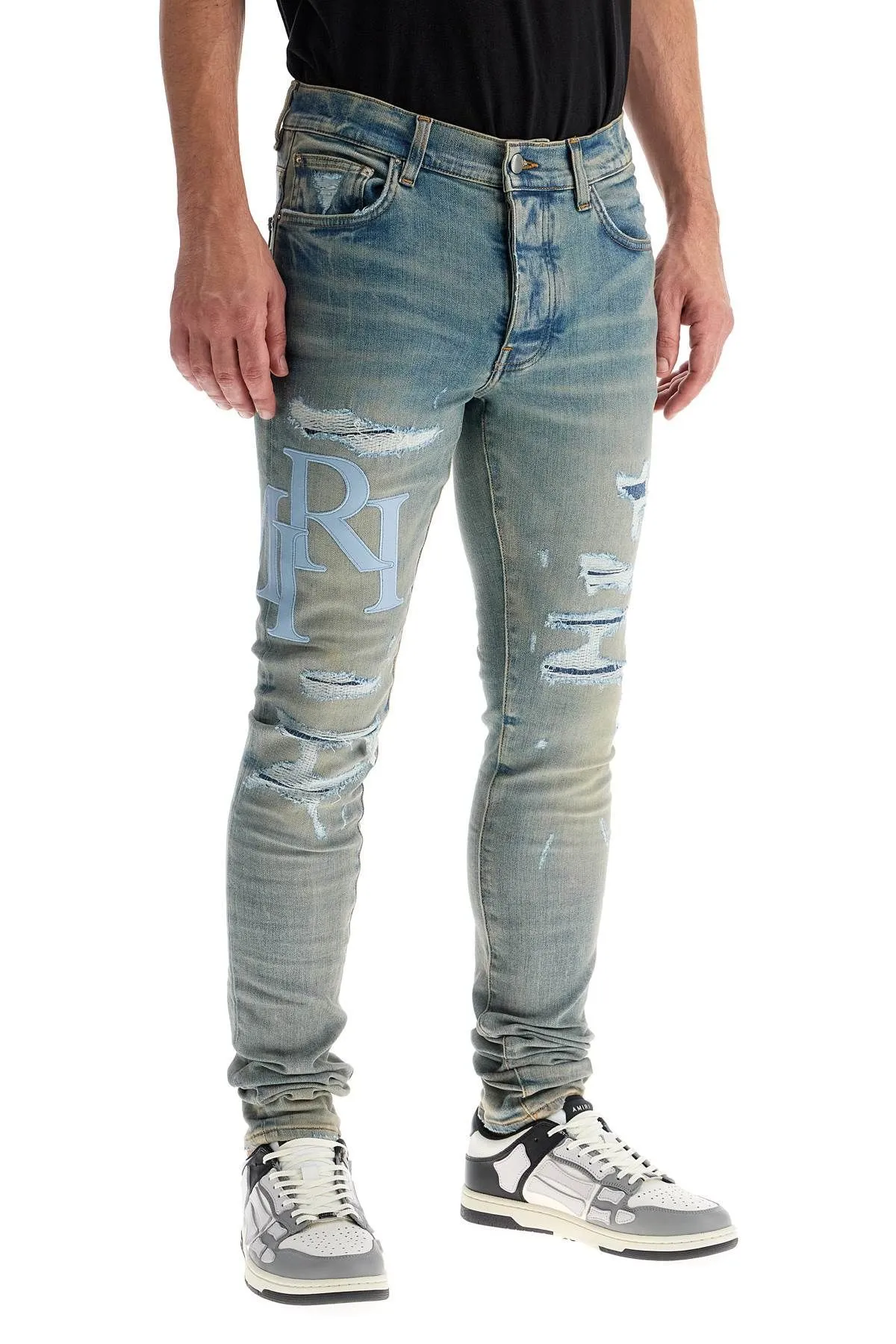 Jeans con logo in pelle