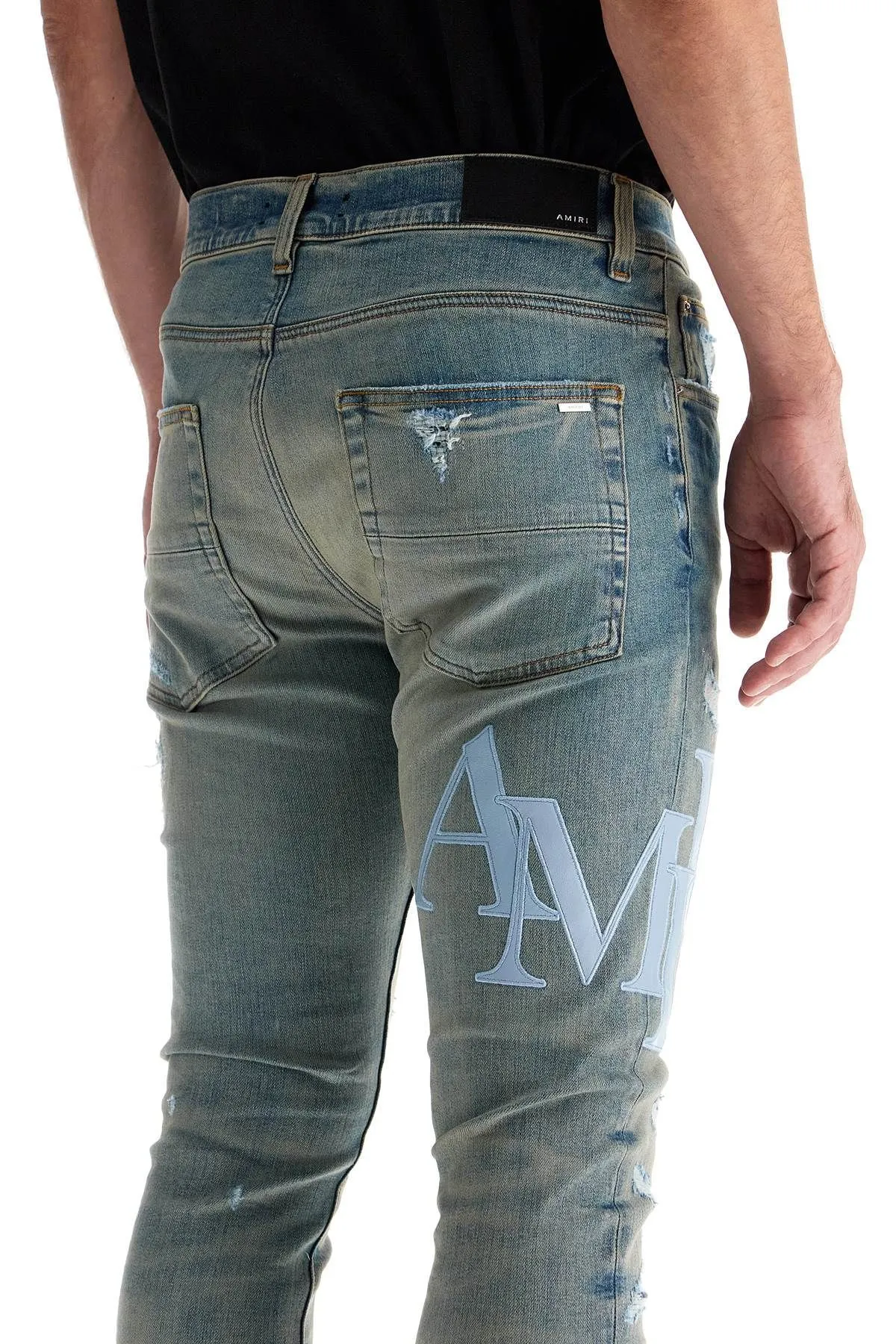 Jeans con logo in pelle